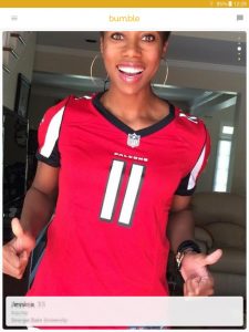 Example of a Bumble profile picture: female Atlanta Falcons fan