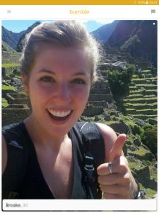 Example of a Bumble profile picture: happy girl at Machu Picchu