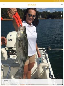 Example of a Bumble profile picture: woman sports fishing