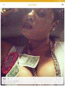 Example of a Bumble profile picture: woman with dollar bills on her breasts